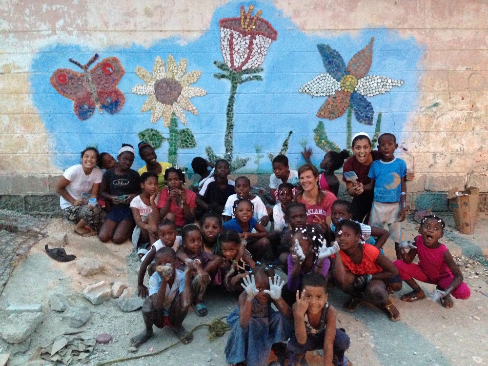 group photo in front of the new mosaic mural